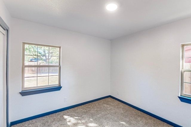 empty room featuring carpet floors