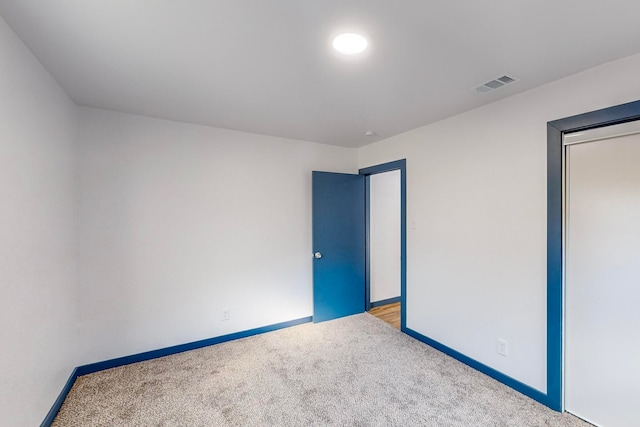 unfurnished bedroom with carpet flooring