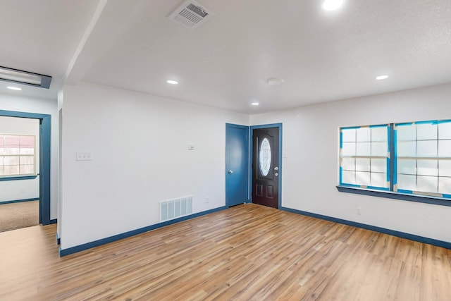 unfurnished room with light hardwood / wood-style floors