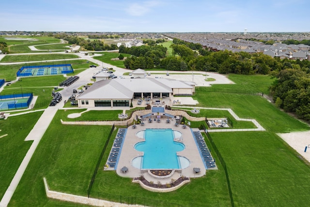 view of swimming pool with a patio and a lawn