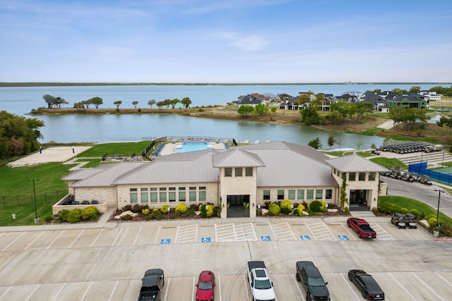 birds eye view of property with a water view