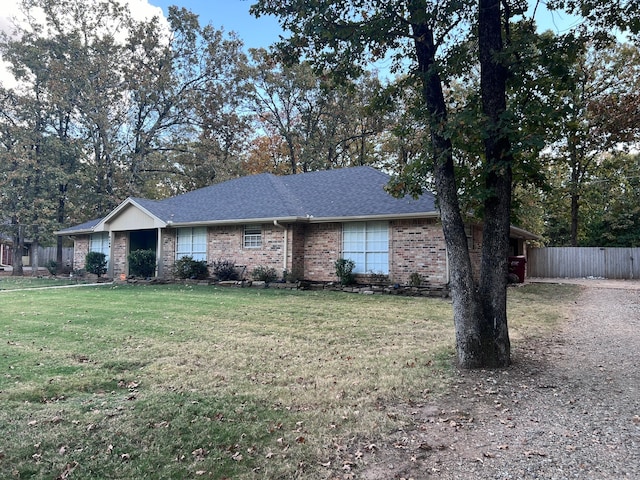 single story home featuring a front yard