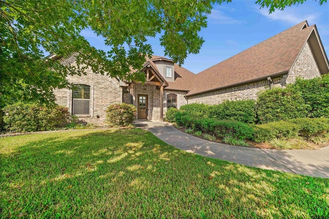 view of front of property with a front lawn