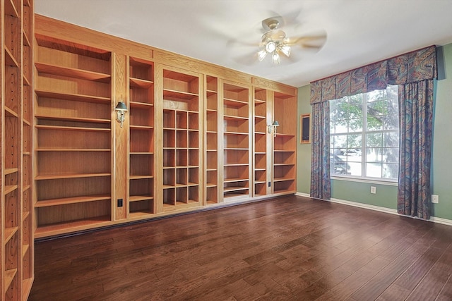 unfurnished room featuring ceiling fan and dark hardwood / wood-style flooring