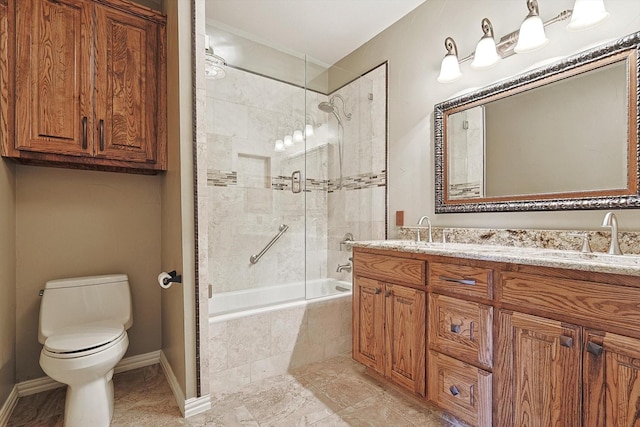 full bathroom featuring tiled shower / bath combo, vanity, and toilet