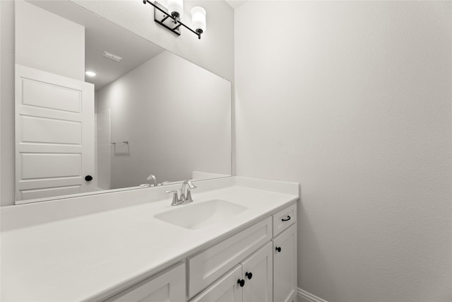 bathroom with vanity and visible vents