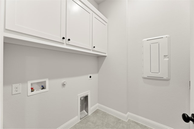 laundry area featuring baseboards, washer hookup, gas dryer hookup, cabinet space, and electric dryer hookup