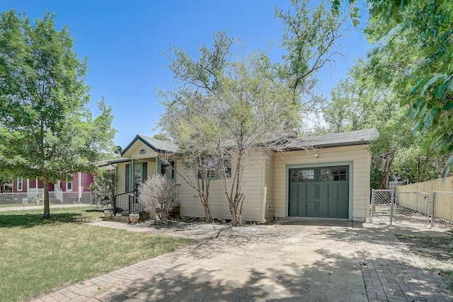 view of front of home featuring a front lawn and a garage