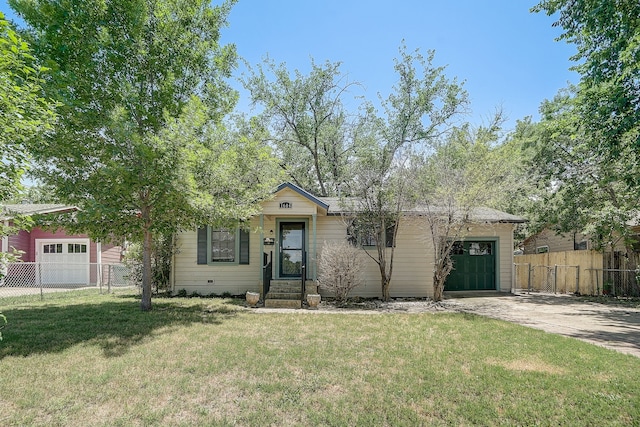 view of front of home with a front yard and a garage