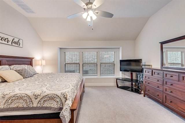 bedroom featuring ceiling fan, lofted ceiling, and light carpet