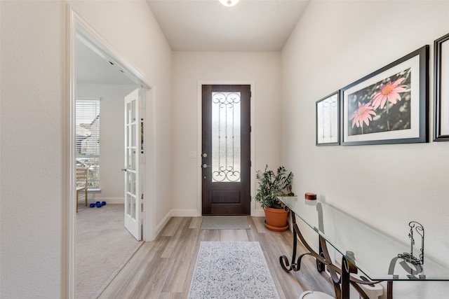 foyer entrance featuring light wood-type flooring