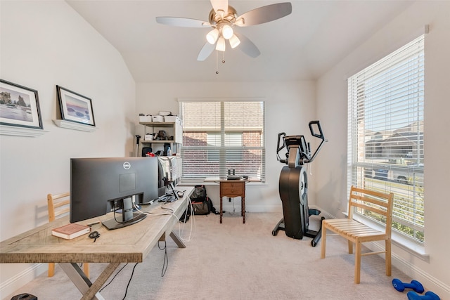 home office with light carpet, a wealth of natural light, lofted ceiling, and ceiling fan