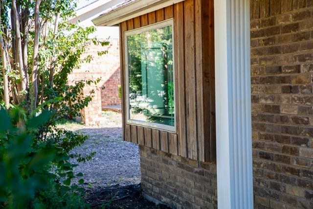 exterior space featuring brick wall