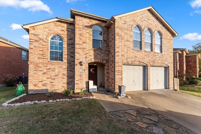 view of front of house with central AC and a garage