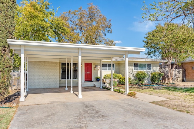 single story home with a carport