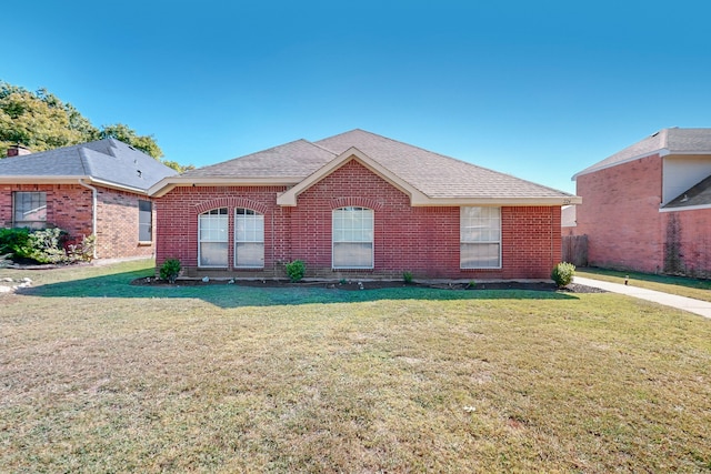 ranch-style home featuring a front yard