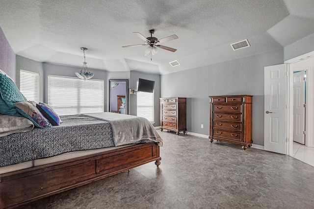 bedroom featuring ceiling fan and a textured ceiling