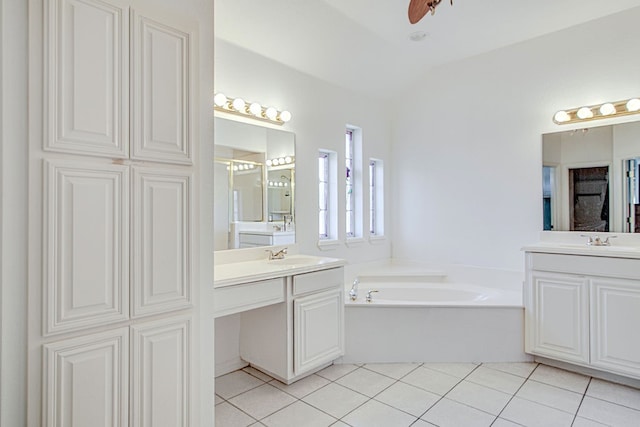 bathroom featuring vanity, tile patterned floors, ceiling fan, and a bathing tub