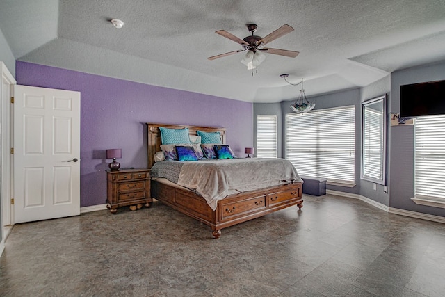 bedroom featuring a textured ceiling and ceiling fan