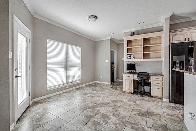 office space with ornamental molding, built in desk, and a textured ceiling