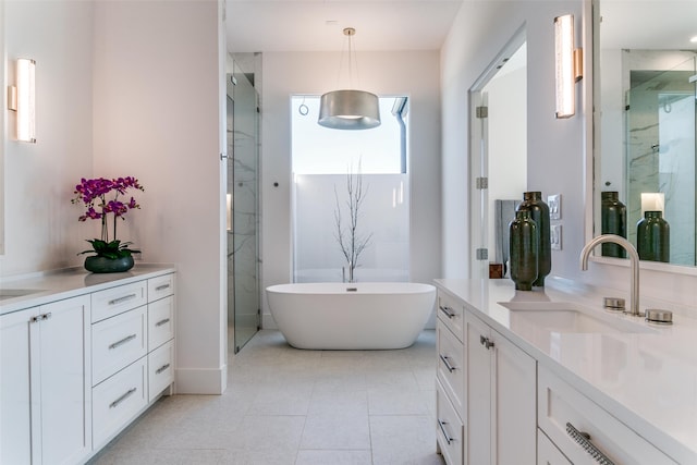 315 Regal Ln, Irving, TX 75039 - bathroom featuring vanity, a marble finish shower, a freestanding tub, and tile patterned floors