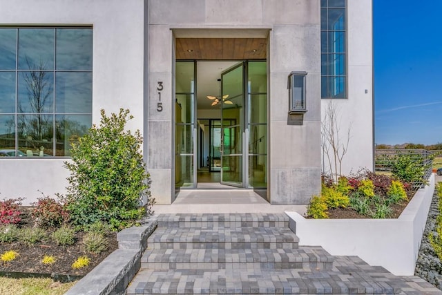 doorway to property with stucco siding