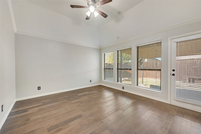 spare room with ornamental molding, ceiling fan, vaulted ceiling, and dark hardwood / wood-style floors