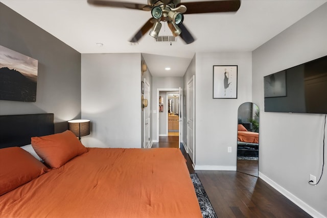 bedroom with ceiling fan and dark hardwood / wood-style flooring