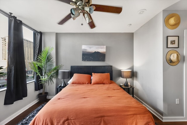 bedroom featuring ceiling fan and dark hardwood / wood-style floors