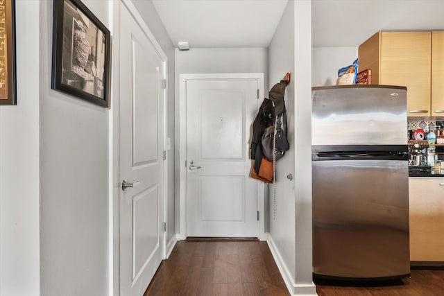 corridor with dark hardwood / wood-style floors