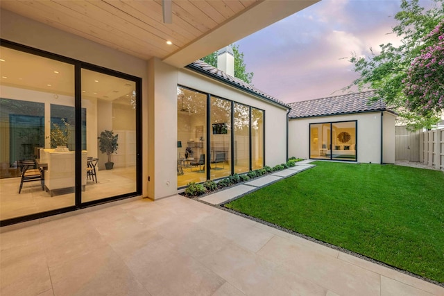 exterior space featuring a yard and a patio area