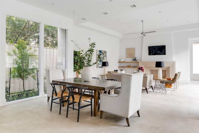 tiled dining area featuring ceiling fan