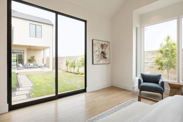 interior space with wood finished floors and baseboards