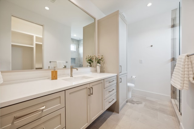 bathroom with vanity, recessed lighting, a shower stall, and toilet