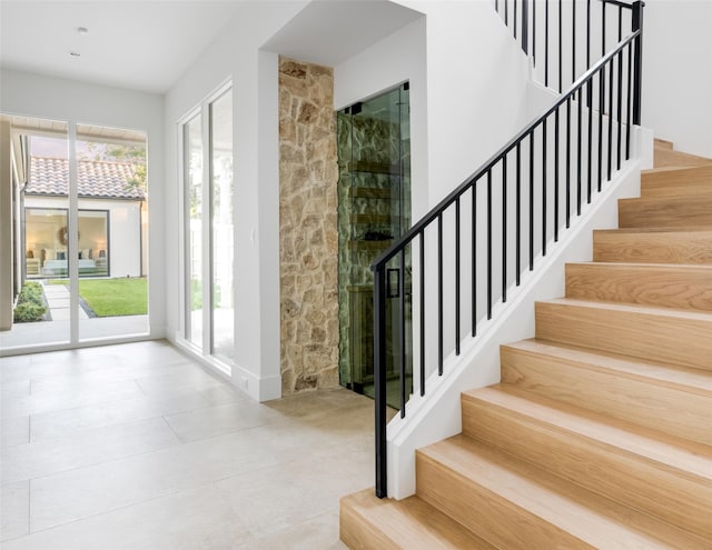 staircase with tile patterned flooring