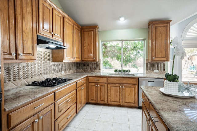 kitchen featuring decorative backsplash, light tile patterned floors, black gas stovetop, stainless steel dishwasher, and sink