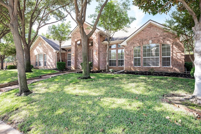 view of property featuring a front yard