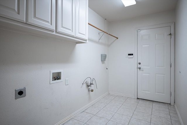 laundry room with hookup for a gas dryer, hookup for a washing machine, hookup for an electric dryer, light tile patterned floors, and cabinets