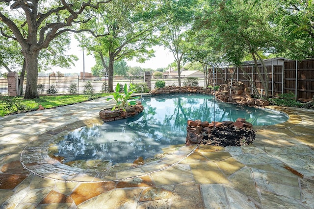 view of pool featuring a patio area