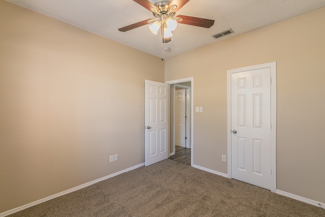 unfurnished bedroom featuring carpet flooring and ceiling fan