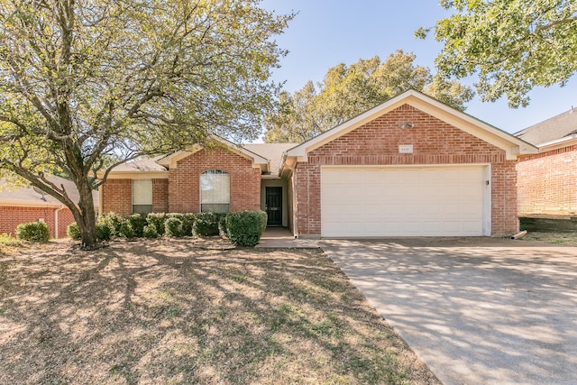 ranch-style house featuring a garage