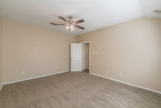 unfurnished room featuring ceiling fan, vaulted ceiling, and carpet floors