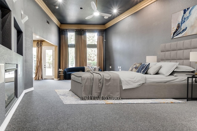 bedroom featuring ceiling fan, crown molding, and light carpet