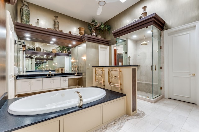 bathroom featuring vanity and separate shower and tub