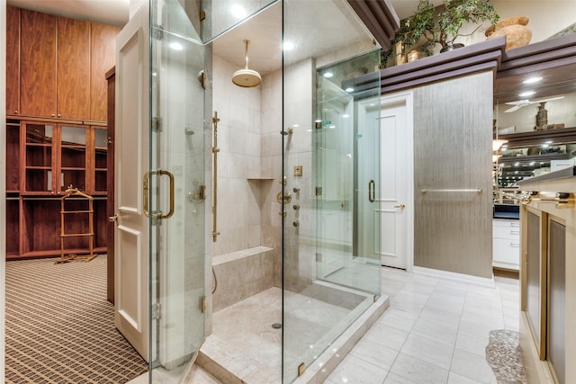 bathroom with tile patterned flooring and a shower with door