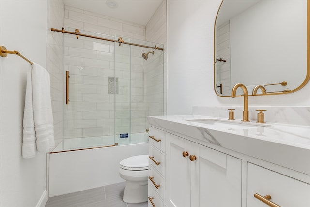 full bathroom with vanity, toilet, and bath / shower combo with glass door