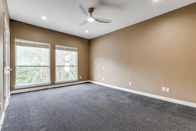 unfurnished room featuring ceiling fan and carpet