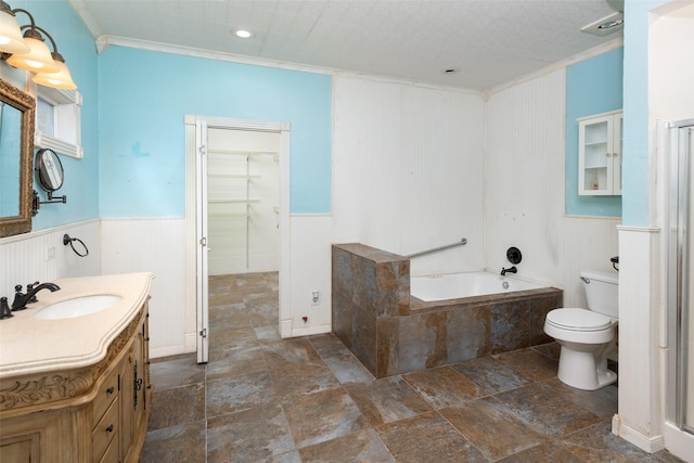 bathroom with ornamental molding, a bathing tub, vanity, and toilet