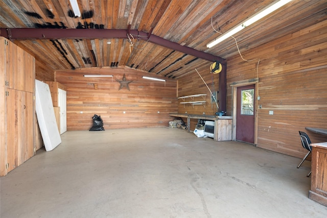 garage featuring wood walls