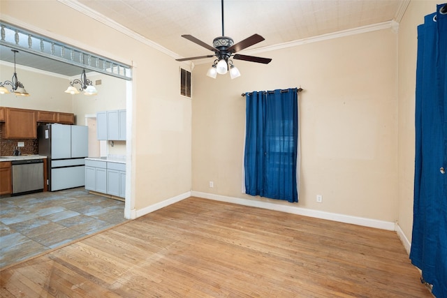 unfurnished living room featuring ornamental molding, ceiling fan with notable chandelier, and light hardwood / wood-style flooring